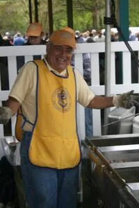 Norfolk Sertoma mans the grill station at the Spring Fever event